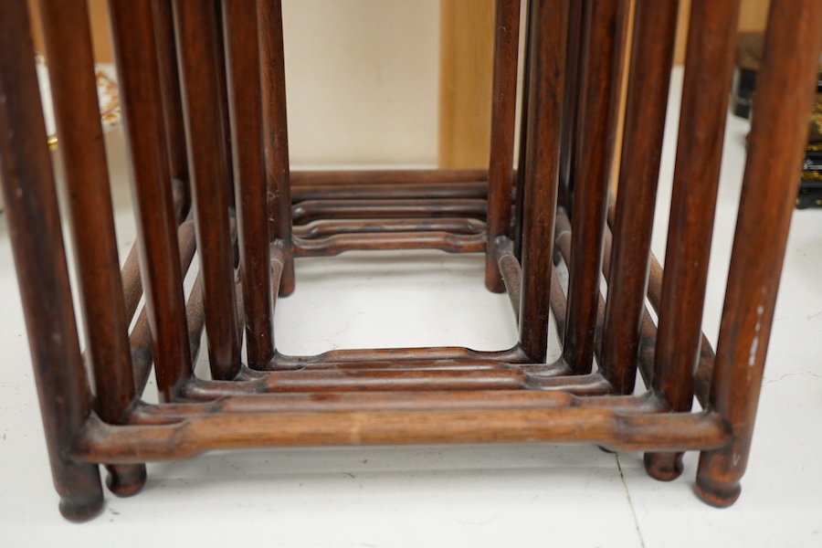 A nest of five Chinese hardwood stands, tallest (largest) 32cm high